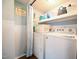 Bright laundry room with washer, dryer, and ample storage at 101 Mulberry Ln, Dunn, NC 28334