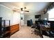 Bright home office with a desk, chair, and shelving at 101 Mulberry Ln, Dunn, NC 28334