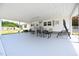 Covered carport with rocking chairs and yard view at 101 Mulberry Ln, Dunn, NC 28334