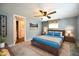 Main bedroom with ceiling fan and ensuite bathroom access at 101 Mulberry Ln, Dunn, NC 28334