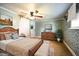 Cozy bedroom with wood furniture and decorative wall paper at 101 Mulberry Ln, Dunn, NC 28334