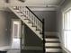 Elegant staircase with dark wood and white railings at 3124 Raleigh Rd, Henderson, NC 27537