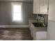 Kitchen with white cabinets and stainless steel sink at 3124 Raleigh Rd, Henderson, NC 27537