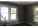 Spacious living room with large windows and hardwood floors at 3124 Raleigh Rd, Henderson, NC 27537