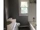 Bathroom with white vanity, toilet, and bathtub at 3124 Raleigh Rd, Henderson, NC 27537