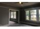 Spacious living room with gray walls and carpet at 3124 Raleigh Rd, Henderson, NC 27537