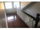 Long hallway with hardwood floors and a railing at 3124 Raleigh Rd, Henderson, NC 27537
