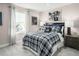 Comfortable bedroom with navy and white bedding and plenty of natural light at 508 Impala Trce, Wendell, NC 27591