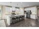 Modern kitchen featuring white cabinets, granite countertops, and stainless steel appliances at 508 Impala Trce, Wendell, NC 27591