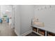 White bench with storage and coat hooks, perfect for a drop zone at 541 Henham Way, Zebulon, NC 27597