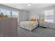 Bright bedroom with a queen bed and window at 541 Henham Way, Zebulon, NC 27597