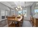 Elegant dining room with hardwood floors and a chandelier at 541 Henham Way, Zebulon, NC 27597