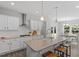 Modern kitchen with stainless steel appliances and white cabinets at 541 Henham Way, Zebulon, NC 27597