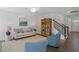 Bright living room with comfy seating, hardwood floors, and a view of the kitchen at 541 Henham Way, Zebulon, NC 27597