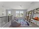 Spacious playroom with two beanbag chairs and built-in shelving at 541 Henham Way, Zebulon, NC 27597
