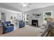 Spacious living area featuring a fireplace and large windows at 541 Henham Way, Zebulon, NC 27597