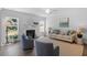 Cozy living room with hardwood floors, a fireplace, and comfortable seating at 541 Henham Way, Zebulon, NC 27597
