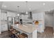 Modern kitchen with white cabinets, large island, and stainless steel appliances at 541 Henham Way, Zebulon, NC 27597