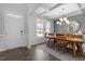 Spacious dining room with hardwood floors and a farmhouse table at 541 Henham Way, Zebulon, NC 27597