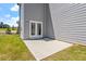Side yard with a patio and access to the house at 541 Henham Way, Zebulon, NC 27597