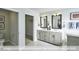Bathroom with double vanity and access to a walk-in closet at 2222 Cherry Top Dr, Fuquay Varina, NC 27526