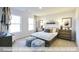 Spacious bedroom with large windows and hardwood floors at 2222 Cherry Top Dr, Fuquay Varina, NC 27526