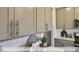 Close-up view of sleek gray kitchen cabinets with brushed nickel hardware at 2222 Cherry Top Dr, Fuquay Varina, NC 27526