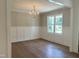 Formal dining room with hardwood floors and a chandelier at 200 Whistlers Cv, Louisburg, NC 27549