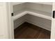 Spacious corner pantry with ample shelving at 200 Whistlers Cv, Louisburg, NC 27549