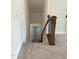 Staircase leading down to the lower level, carpeted flooring throughout at 200 Whistlers Cv, Louisburg, NC 27549