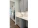 Kitchen wet bar with gray cabinets, quartz countertops, and a sink at 200 Whistlers Cv, Louisburg, NC 27549