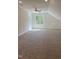 Large bonus room with carpeted floors and a ceiling fan at 200 Whistlers Cv, Louisburg, NC 27549
