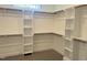 Large walk-in closet with ample shelving and hanging space at 200 Whistlers Cv, Louisburg, NC 27549