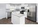 Modern kitchen with stainless steel appliances, granite countertops, and hardwood floors at 4507 Black Drum Dr, Raleigh, NC 27616