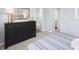 Bedroom with dresser and access to bathroom at 4507 Black Drum Dr, Raleigh, NC 27616