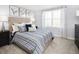 Main bedroom with large window, a plush bed, and ample closet space at 4511 Black Drum Dr, Raleigh, NC 27616