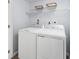 Convenient laundry room with washer, dryer, and overhead shelving at 4511 Black Drum Dr, Raleigh, NC 27616