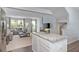 Open kitchen with island and view into living room at 4511 Black Drum Dr, Raleigh, NC 27616