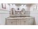 Double vanity bathroom with granite countertop and oval mirrors at 468 Loftis Loop Rd, Roxboro, NC 27574