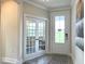Bright entryway with French doors leading to an office at 112 Fast Pitch Ln, Four Oaks, NC 27524