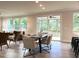 Casual dining area with access to screened porch and kitchen at 112 Fast Pitch Ln, Four Oaks, NC 27524