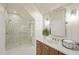 Modern bathroom with glass shower, wood vanity, and white shiplap walls at 1641 Legacy Ridge Ln, Wake Forest, NC 27587