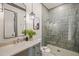 Modern bathroom with a walk-in shower, tiled walls, and updated fixtures at 1641 Legacy Ridge Ln, Wake Forest, NC 27587
