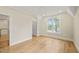 Bright bedroom with hardwood floors, ceiling fan, and large window at 1641 Legacy Ridge Ln, Wake Forest, NC 27587