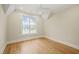 Bright, airy bedroom with large window and hardwood floors at 1641 Legacy Ridge Ln, Wake Forest, NC 27587