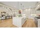 Open concept kitchen with large island, modern appliances, and hardwood floors at 1641 Legacy Ridge Ln, Wake Forest, NC 27587