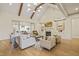 Inviting living room with vaulted ceilings, exposed beams, fireplace, and ample natural light at 1641 Legacy Ridge Ln, Wake Forest, NC 27587