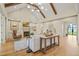 Living room with wood floors, high ceilings, fireplace, and access to the outdoors at 1641 Legacy Ridge Ln, Wake Forest, NC 27587