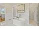 Luxurious main bathroom with soaking tub, walk-in shower, and marble tile at 1641 Legacy Ridge Ln, Wake Forest, NC 27587