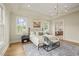 Main bedroom with elegant chandelier, ensuite bathroom access, and hardwood floors at 1641 Legacy Ridge Ln, Wake Forest, NC 27587